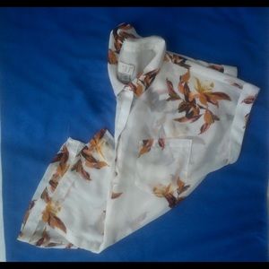 Button up blouse. White with leaves design.